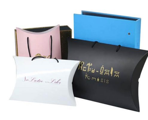 Assorted custom pillow boxes with various finishes and handles for hair extension packaging