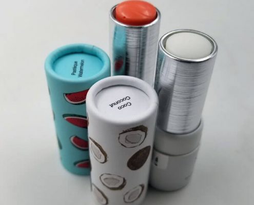 Lip balm containers with branded paper tubes and durable inner twist-up design – Personalized lip balm containers showcasing brand identity with eco-friendly materials.