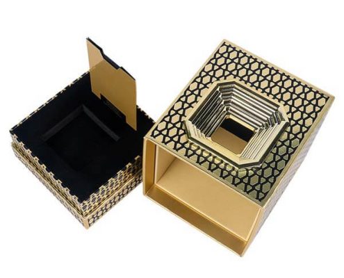 Elegant rigid perfume packaging with gold embossed finish.