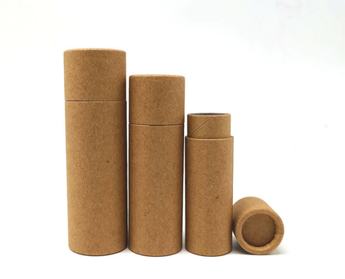 Assorted brown eco-friendly cardboard lip balm tubes in various sizes for sustainable packaging