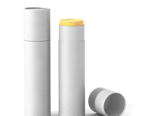 White and yellow eco-friendly lip balm tubes with recyclable caps for sustainable beauty packaging