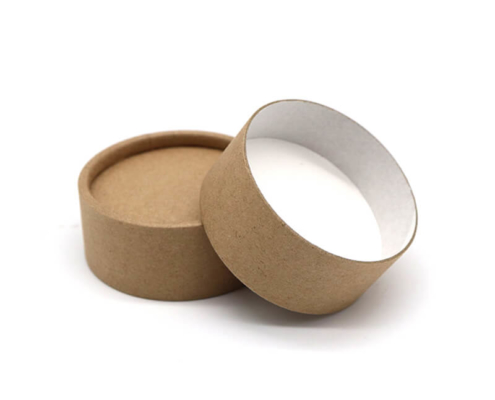 Minimalist kraft paper salve container with a white interior, offering sustainable packaging for beauty products.