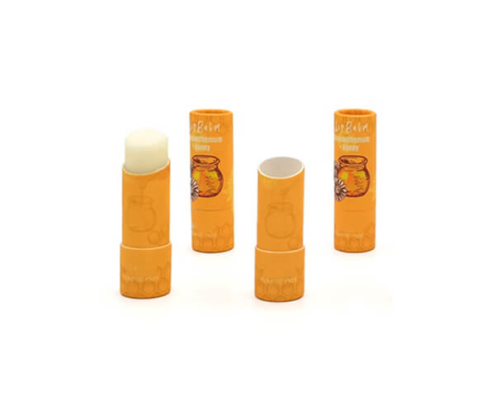 Recyclable paper lip balm tubes with oil-resistant lining for storing solid perfumes and balms.