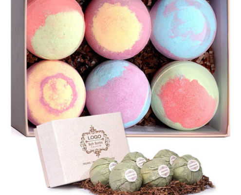 Pastel-colored bath bomb box packaging – A beige box filled with six large bath bombs in soft pastel hues, accompanied by a smaller rustic box with logo branding, enhancing the organic and luxury appeal.