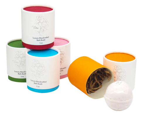 Colorful single bath bomb packaging tubes with open lid – A variety of round bath bomb tubes with bright interior colors, showcasing eco-friendly packaging options for retail or gifting.