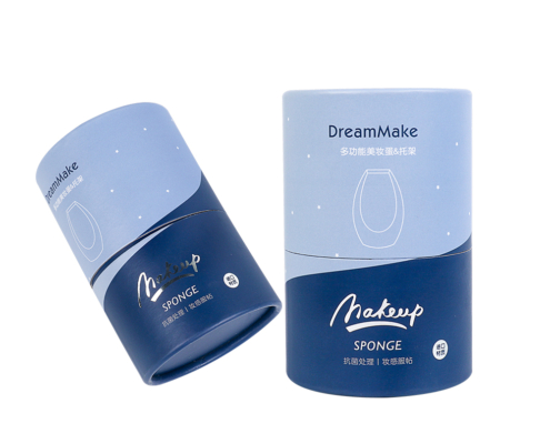 Blue and navy eco-friendly paper tube packaging for a beauty blender with the “DreamMake” logo, offering a sleek and sustainable design.