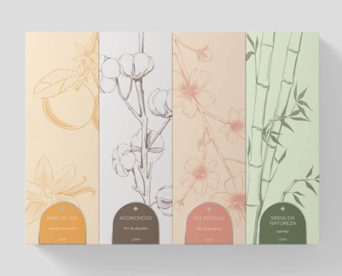 Set of four reed diffuser boxes with various botanical designs