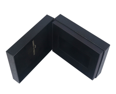 Open luxury perfume box with hinged lid, displaying a deep foam insert for perfume protection