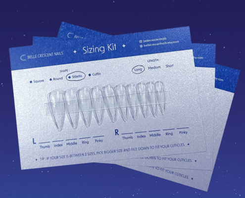 Press on nail packaging boxes and sizing kit cards laid out, showcasing customization options for nail shapes and sizes.