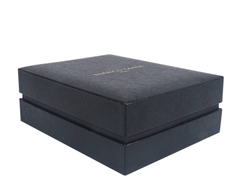 Closed luxury perfume box showcasing its refined, textured leather-like outer surface