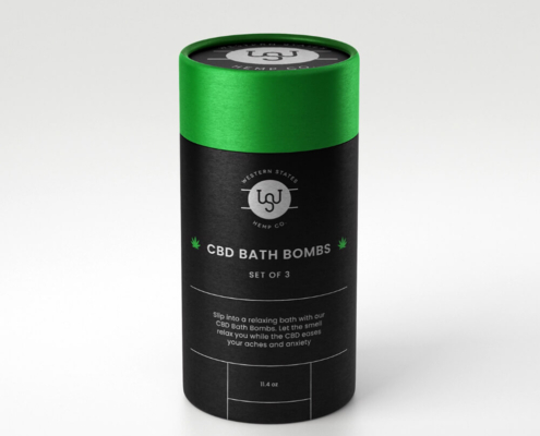 Premium CBD bath bomb packaging with green lid and elegant black body design.