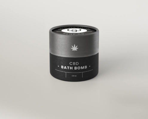 Set of CBD bath bomb tubes showcasing branding, ingredients, and eco-friendly materials.