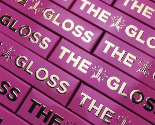 Professional Custom Lip Gloss Packaging for Retail Displays - Eye-catching straight tuck-end box with a glossy pink finish and gold foil details for a standout retail presence.