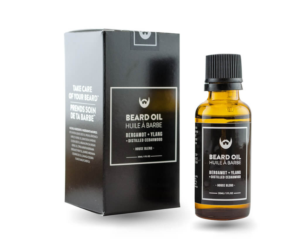 Premium beard oil packaging box in black, featuring "Beard Oil Huile à Barbe" with a brown glass dropper bottle placed beside it.