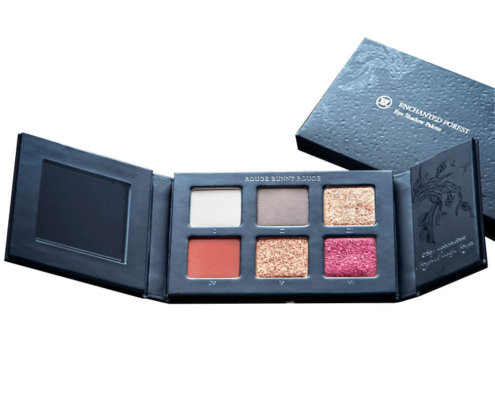 Black custom eyeshadow palette with intricate design for luxury cosmetics packaging