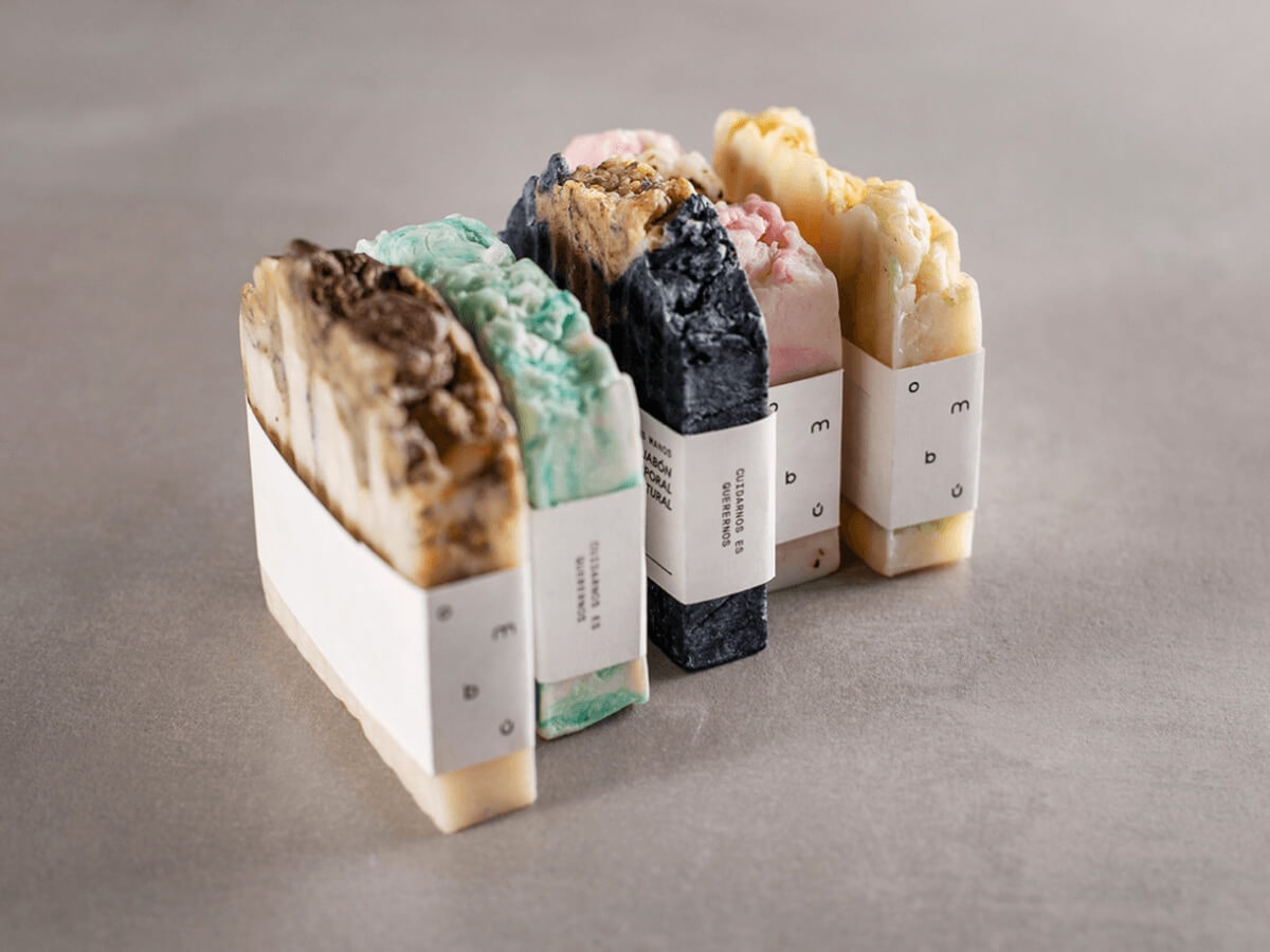 Luxury soap bars displayed with sleek, custom-printed sleeves.