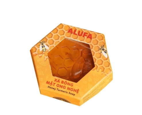 Hexagon soap boxes with a clear window showcasing honey turmeric soap.