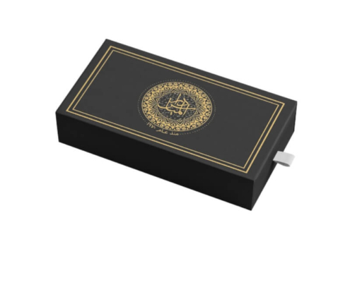 Custom black box with intricate gold design and pull-tab drawer – A fully closed drawer box with elegant gold framing and a central decorative element, designed for premium packaging solutions.