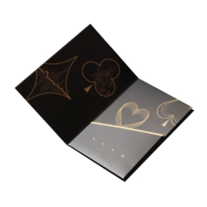 Foldable black hotel key card holder with decorative elements – An open black custom card holder with gold suit patterns, designed to provide secure storage for key cards and marketing materials, enhancing the hotel’s branding.