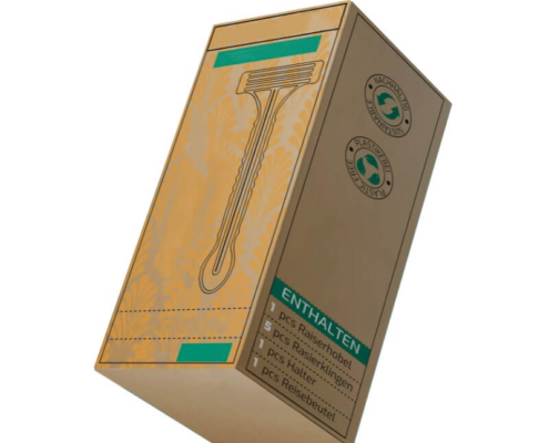 Natural brown kraft razor packaging box with eco-conscious labels and custom green print accents.