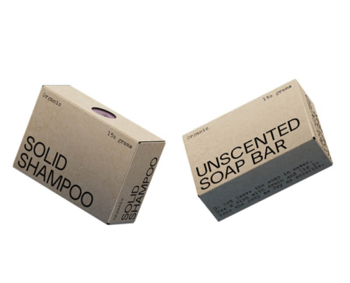 Pair of customized soap boxes showcasing "Solid Shampoo" and "Unscented Soap Bar" designs, made from recyclable kraft material.