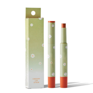 Green lipstick box packaging with floral design and matching lipstick tube displayed upright, featuring a hang hole for easy retail display.