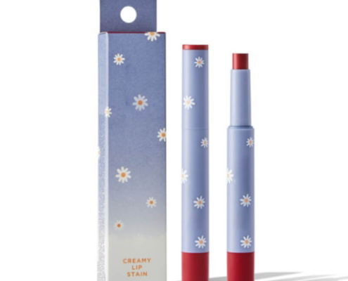 Blue lipstick box packaging with floral prints, paired with a matching lipstick tube, designed for premium cosmetic branding.