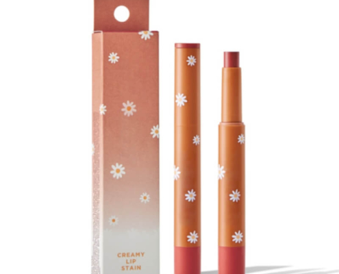 Orange lipstick box packaging with floral details, showcasing a matching lipstick tube, ideal for retail and eco-conscious branding.