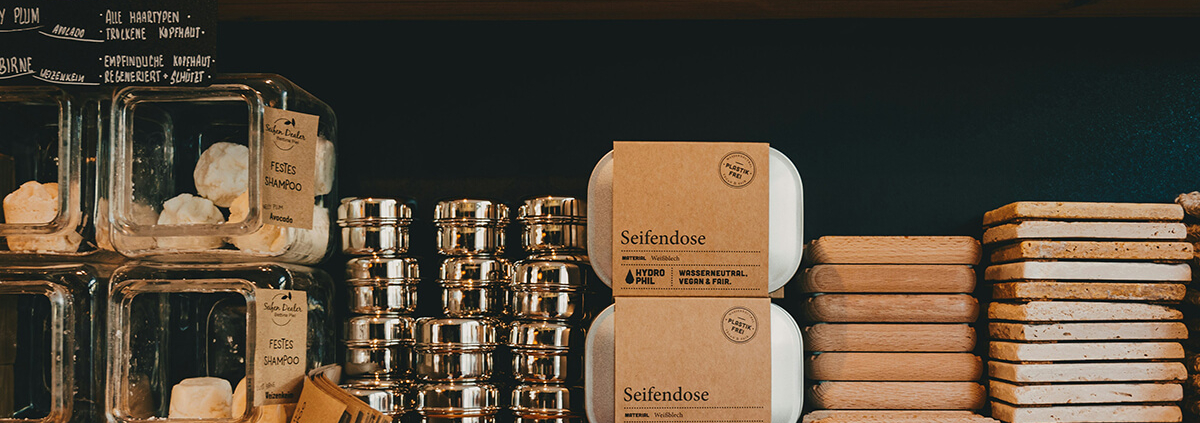 soaps packed in brown kraft paper sleeves and displayed in the shelf