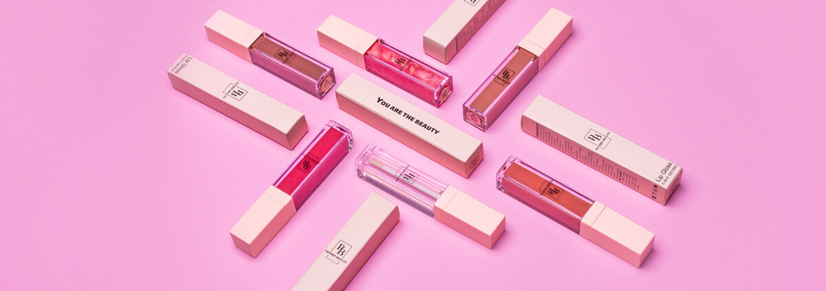 Custom lip gloss boxes with premium packaging design in pink, showcasing high-quality lip gloss packaging solutions from top vendors