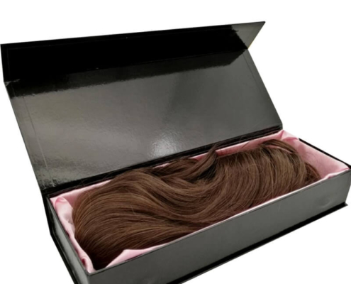 Glossy black rigid box with a magnetic closure and pink satin interior, ideal for secure and luxurious hair extension packaging.