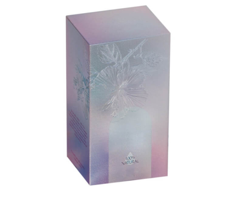 Luxurious custom lotion box in soft pastel tones with embossed floral design, made from premium art paper.