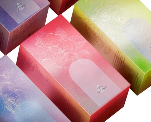 A collection of colorful custom lotion boxes with embossed floral designs, showcasing premium finishes and customizable features.