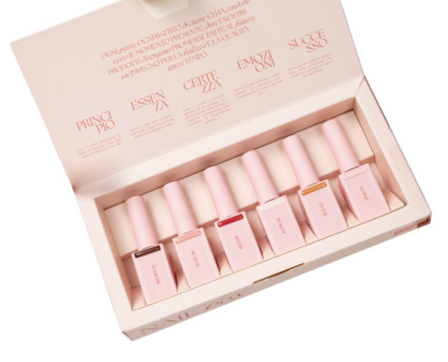 Open custom nail boxes displaying neatly organized nail polish bottles with protective inserts.