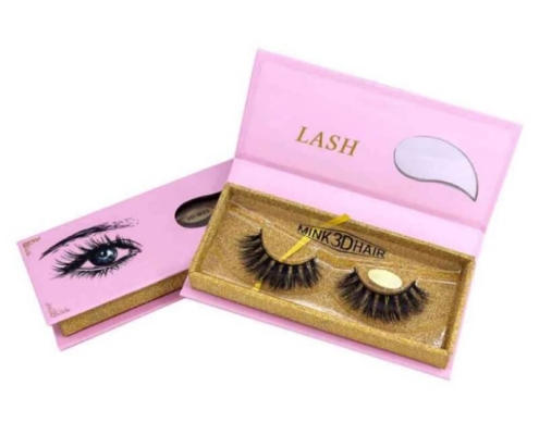 Pink luxury eyelash box with golden lash compartments and branded gold foil details.