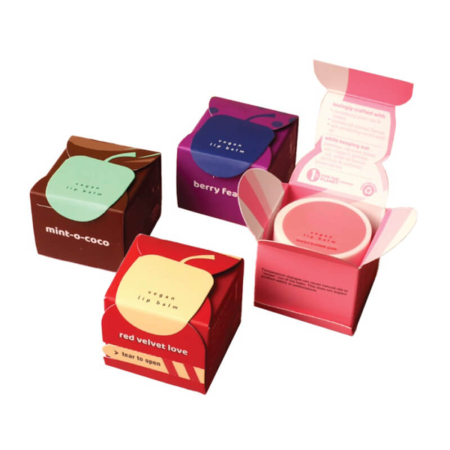 Custom lip balm packaging box with tear-to-open feature and vibrant design.