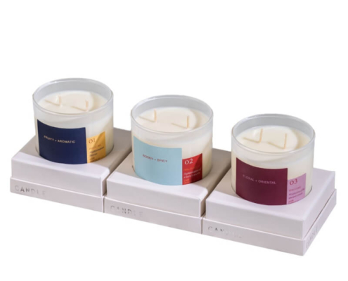 Luxury candle packaging with a high-end design, featuring elegant boxes with colorful and chic branding, ideal for premium candles.