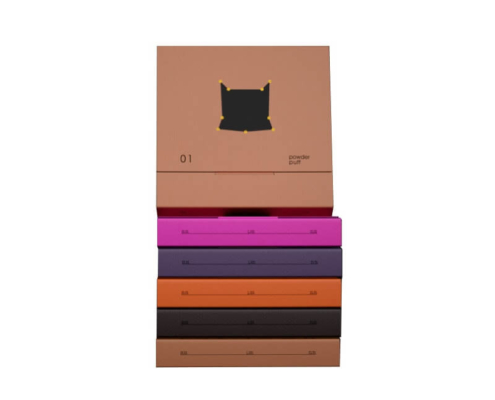 Powder puff packaging boxes in various colors stacked to showcase their chic and customizable design.