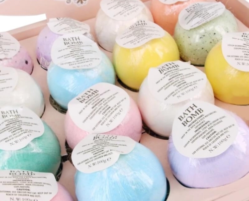 Bath bomb display boxes with colorful pastel bath bombs arranged in a gift-ready presentation.