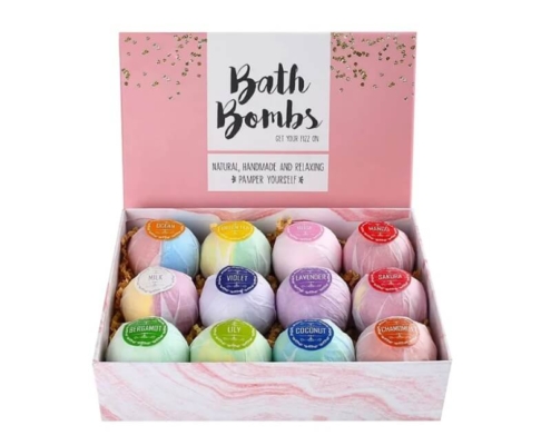 Bath bomb display boxes showcasing a variety of rainbow-colored bath bombs with labeled scents.