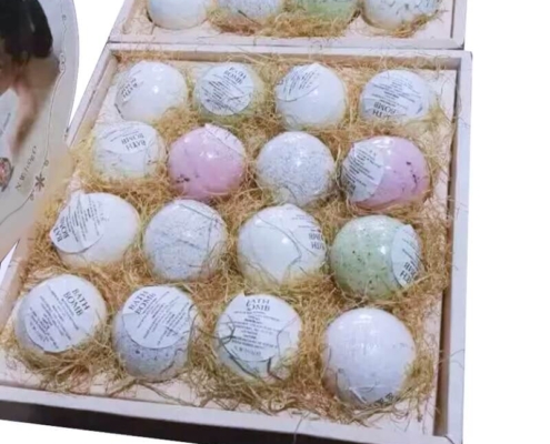 Elegant bath bomb display boxes with handmade bath bombs in natural, eco-friendly packaging.