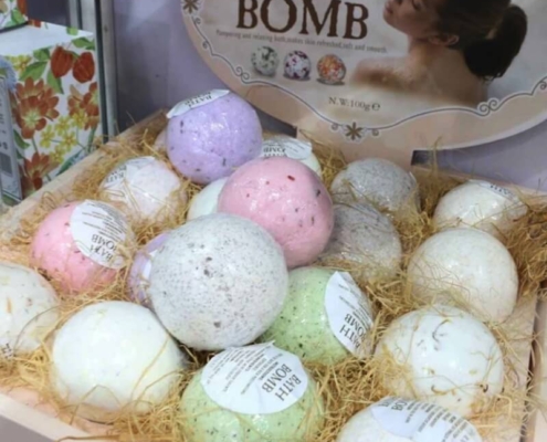 Natural bath bomb display boxes with eco-friendly packaging and a soothing assortment of bath bombs.