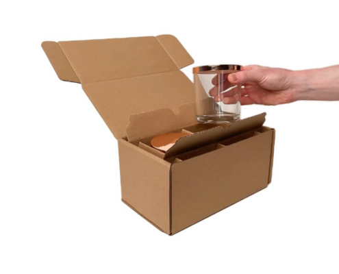 Candle shipping boxes with custom inserts for secure transport of glass candles, ensuring safe delivery.