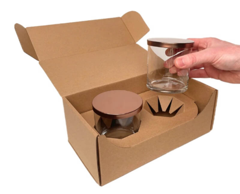 Candle shipping boxes with protective inserts, designed to safely pack and deliver luxury candles without damage.