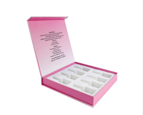Pink custom nail polish set box with foam insert, ideal for organizing and protecting multiple nail polish bottles.