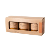 Stacked kraft candle boxes with inserts showing clear custom windows and inserts, a great example of functional and stylish folding cartons packaging.