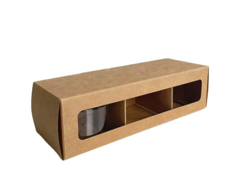 Multiple candle boxes with inserts made from brown kraft paper, showcasing folding cartons packaging stacked for wholesale or retail display.
