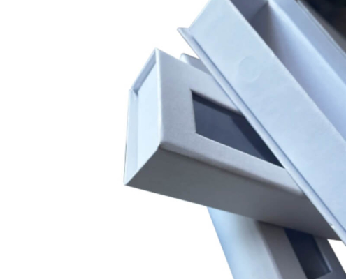 Stacked pearly shine magnetic nail packaging boxes with display windows, perfect for luxury press-on nail presentation.