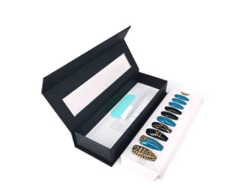 Open black magnetic nail box with organized slots and accessory tray for press-on nails.