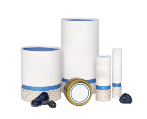 Variety of reed diffuser packaging supplies in white and blue custom paper tubes for wholesale use.